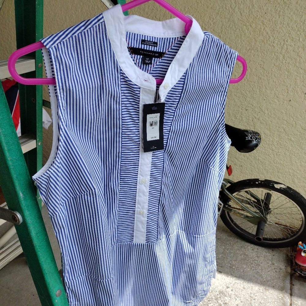 Striped blue and white Tommy Hilfiger sleeveless shirt. Buttons 1/2 way down. Sm